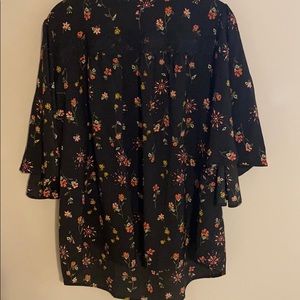 Flouncy floral top with lace detail at top!